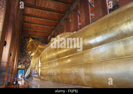 Big Reclining Golden Buddha Statue in Bangkok - Thailand Stock Photo