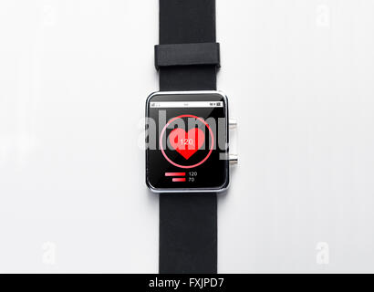 close up of smart watch with heart-rate on screen Stock Photo
