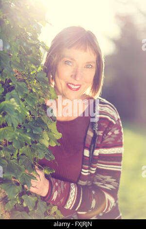 portrait of middle age woman outdoors Stock Photo