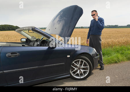 man with broken down car Stock Photo