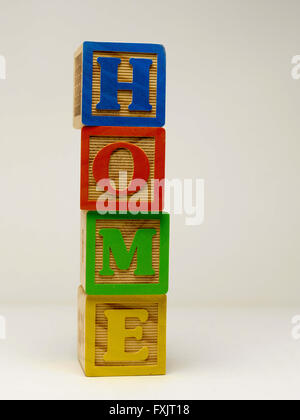 Kid's building blocks spelling the word home. Stock Photo