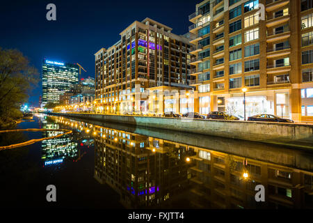 Buildings on the waterfront at night, in Harbor East, Baltimore, Maryland. Stock Photo