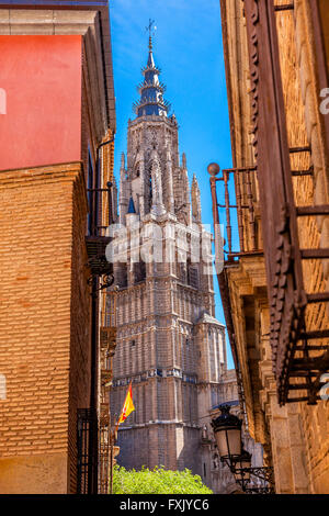 Cathedral Spire Tower Spanish Flag Narrow Streets Medieval City Toledo Spain.  Cathedral started in 1226 finished 1493 Stock Photo