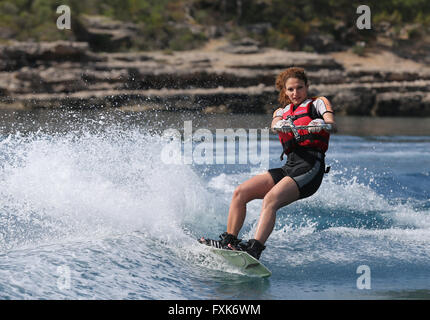 Young woman wakeboarding, Camyuva, Antalya Province, Turkey Stock Photo