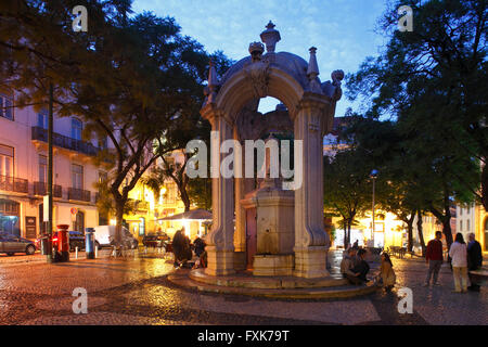 Largo do Carmo square with drinking fountain Chafariz do Carmo at dusk, historic centre Chiado, Lisbon, Portugal Stock Photo