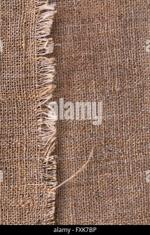 Natural burlap texture with torn edges with space for text, top view Stock Photo