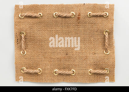 Frame of burlap, lies on a white background, can be used as texture Stock Photo