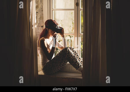 Young woman using the virtual reality headset Stock Photo