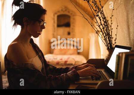 Young woman using laptop Stock Photo