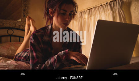 Young woman using laptop Stock Photo