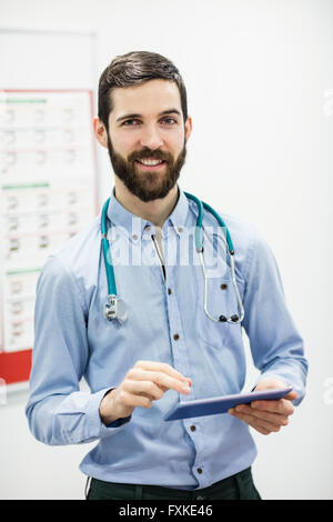 Portrait of doctor using digital tablet Stock Photo