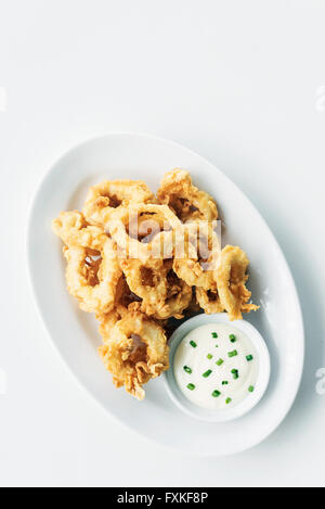 traditional spanish fried calamari squid rings tapas with aioli garlic sauce Stock Photo