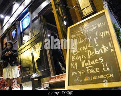 New York, USA. 14th Apr, 2016. A sign in front of the 'Banter', a bar in the Williamsburg neighbourhood, announces the public screening of the debate between Hillary Clinton und Bernie Sanders, in New York, USA, 14 April 2016. Photo: Johannes Schmitt-Tegge/dpa/Alamy Live News Stock Photo