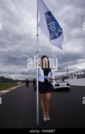 Silverstone, UK. 16th Apr, 2016. European Le Mans Series, Round 1. Storm clouds over Silverstone before the start of the race as a flag girl is pictured. Credit:  Action Plus Sports/Alamy Live News Stock Photo