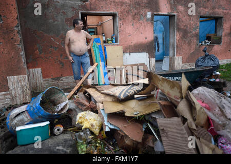 Dolores, Uruguay. 16th Apr, 2016. A man stands in front of his damaged house after a tornado in Dolores, Uruguay, on April 16, 2016. A tornado thrashed the city of Dolores, western Uruguay, on Friday, leaving four people dead and others seriously injured, the country's emergency services said. Credit:  Nicolas Celaya/Xinhua/Alamy Live News Stock Photo