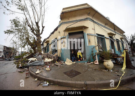 Dolores, Uruguay. 16th Apr, 2016. Women sit in a damaged store after a tornado in Dolores, Uruguay, on April 16, 2016. A tornado thrashed the city of Dolores, western Uruguay, on Friday, leaving four people dead and others seriously injured, the country's emergency services said. Credit:  Nicolas Celaya/Xinhua/Alamy Live News Stock Photo