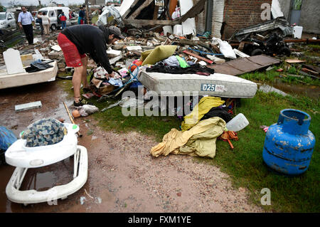 Dolores, Uruguay. 16th Apr, 2016. A man collects his belongings in the debris of his destroyed house after a tornado in Dolores, Uruguay, on April 16, 2016. A tornado thrashed the city of Dolores, western Uruguay, on Friday, leaving four people dead and others seriously injured, the country's emergency services said. Credit:  Nicolas Celaya/Xinhua/Alamy Live News Stock Photo