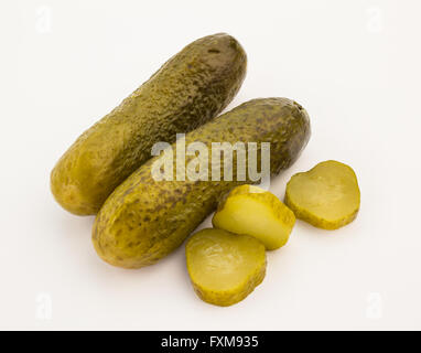 Close up of two pickles and slices isolated on white background Stock Photo