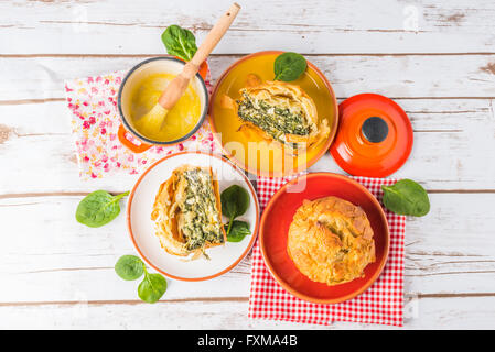 Homemade Spanakopita - Greek spinach pie with feta and ricotta on plates Stock Photo