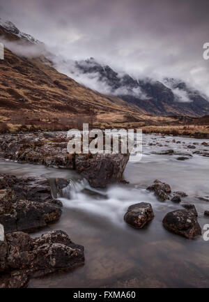 The Aonach Eagach ridge smoldering with low lying cloud as the exposed ...