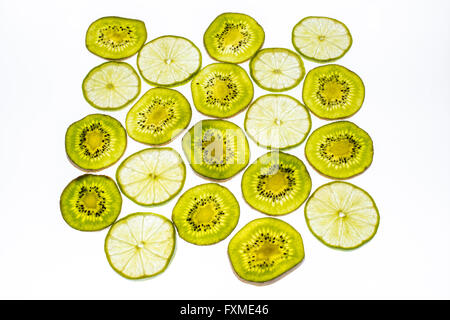 Slices of fresh kiwi fruit isolated on white background Stock Photo