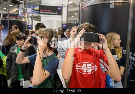 Children take a virtual tour of Mars using immersive VR goggles during Sneak Peek Friday at the USA Science and Engineering Festival at the Walter E. Washington Convention Center April 15, 2016 in Washington, DC. Stock Photo