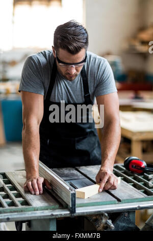 Carpenter working in workshop Stock Photo