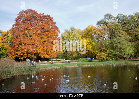 Lake and autumn trees in Ujazdowski Park, city of Warsaw, Poland Stock Photo