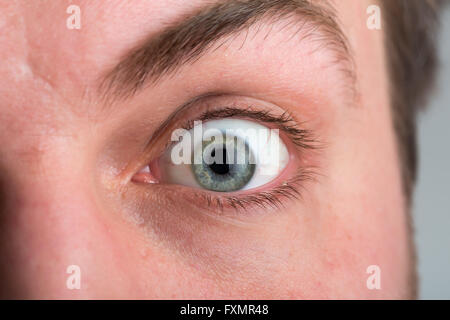 Closeup of surprised male eye Stock Photo