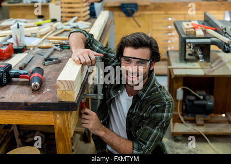 Portrait of male carpenter clamping wood Stock Photo