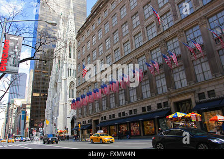 Flags flying outside Saks departmental store on 5th Avenue NYC Stock Photo