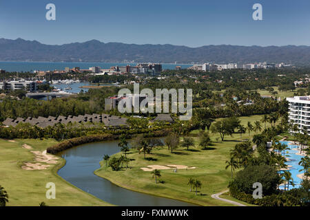 Aerial view of Nicklaus design golf course at Vidanta Nuevo Vallarta Mexico with Sleeping Lady mountain Stock Photo