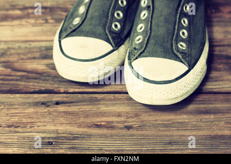 sneakers on wooden deck. Stock Photo