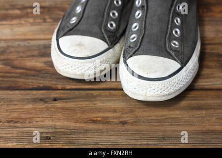 sneakers on wooden deck. Stock Photo