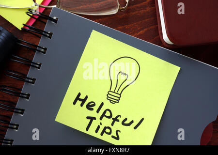 Helpful tips written on a paper. Business concept. Stock Photo