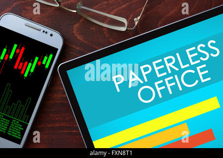 Paperless office written on a tablet. Business concept. Stock Photo