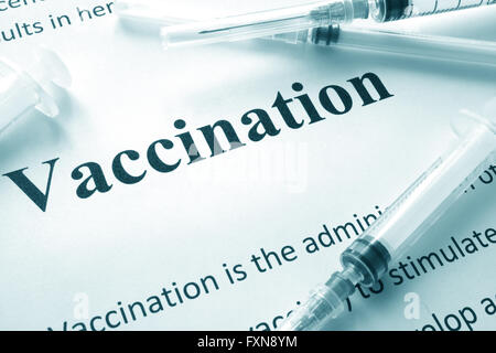 Word Vaccination concept written on a paper. Stock Photo
