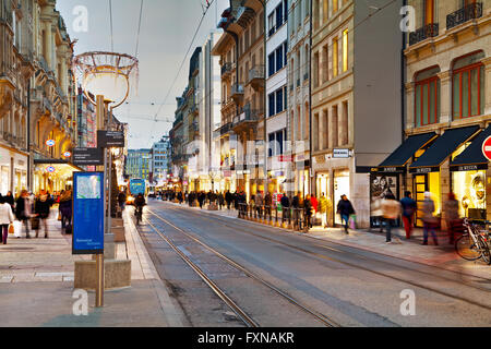 GENEVA, SWITZERLAND - NOVEMBER 27: Rue du Rhone with people on November 27, 2015 in Geneva, Switzerland. Stock Photo