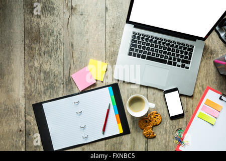 Laptop with other modern electonic devices on desk Stock Photo