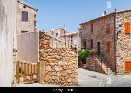 Empty street of Piana town in bright summer day. Corsica island, France