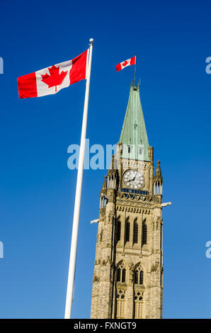 Peace Tower of Canadian Parliament Building in Ottawa, Canada with canadian flag Stock Photo