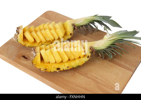 Put sliced ​​pineapple in its own shell. on wood splat. Stock Photo