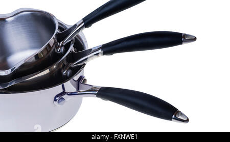 Three stainless steel saucepans. Stock Photo