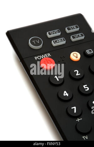 The red button of inclusion on a remote control Stock Photo