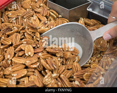 High angle close up view of Pecan Halves in a bin. Stock Photo