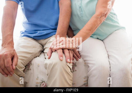 Senior couple holding hands Stock Photo