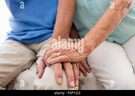 Senior couple holding hands Stock Photo