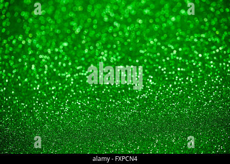 Green glitter surface with green light bokeh - It can be used for background for special occasions promotion campaign or product Stock Photo