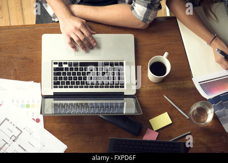 Team members working side by side Stock Photo