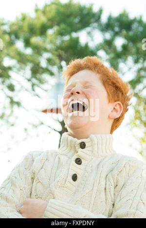 Father and son laughing together outdoors Stock Photo